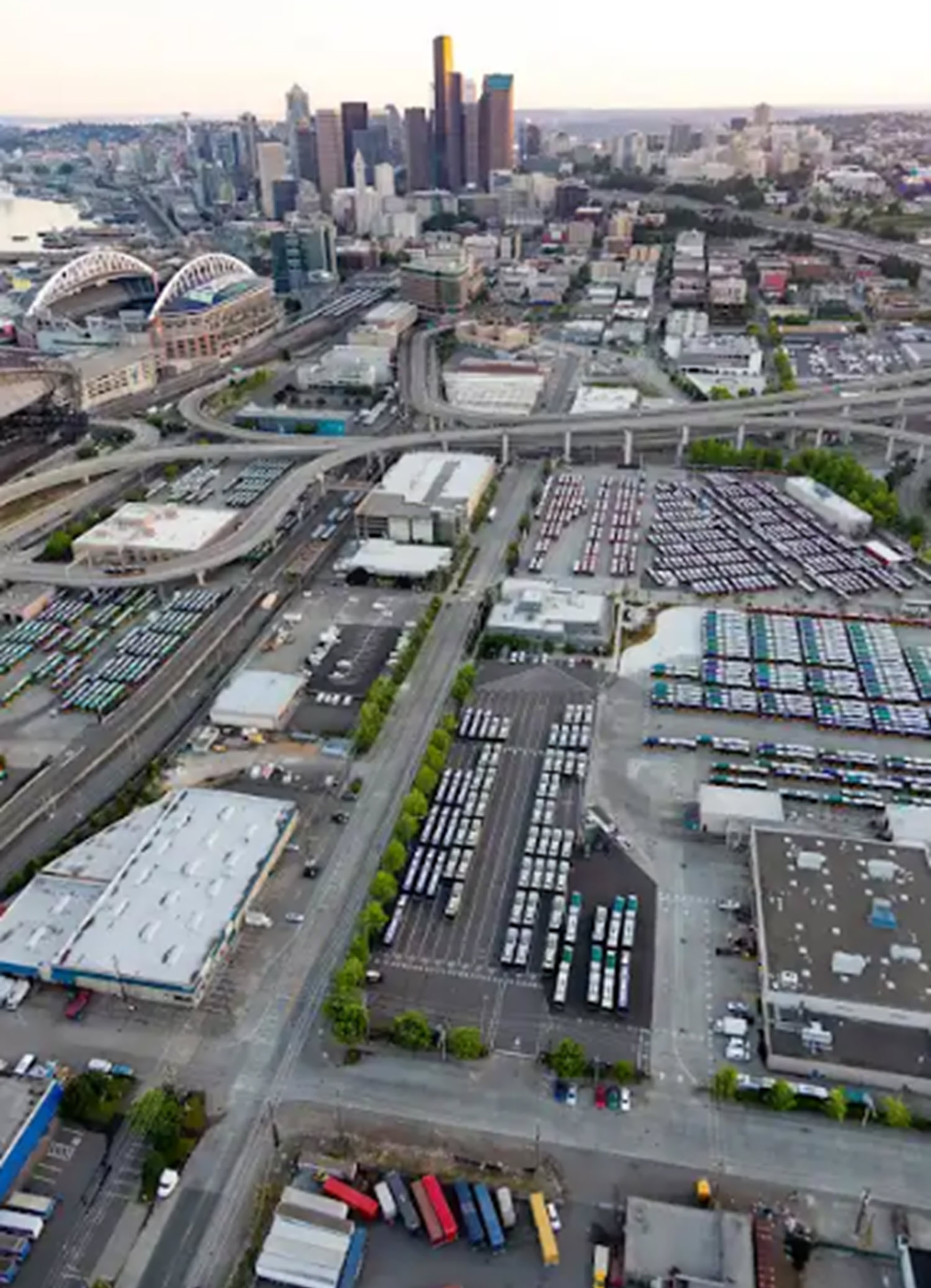 aerial view of bus base among city skyline