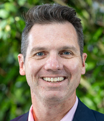 man smiles for the camera