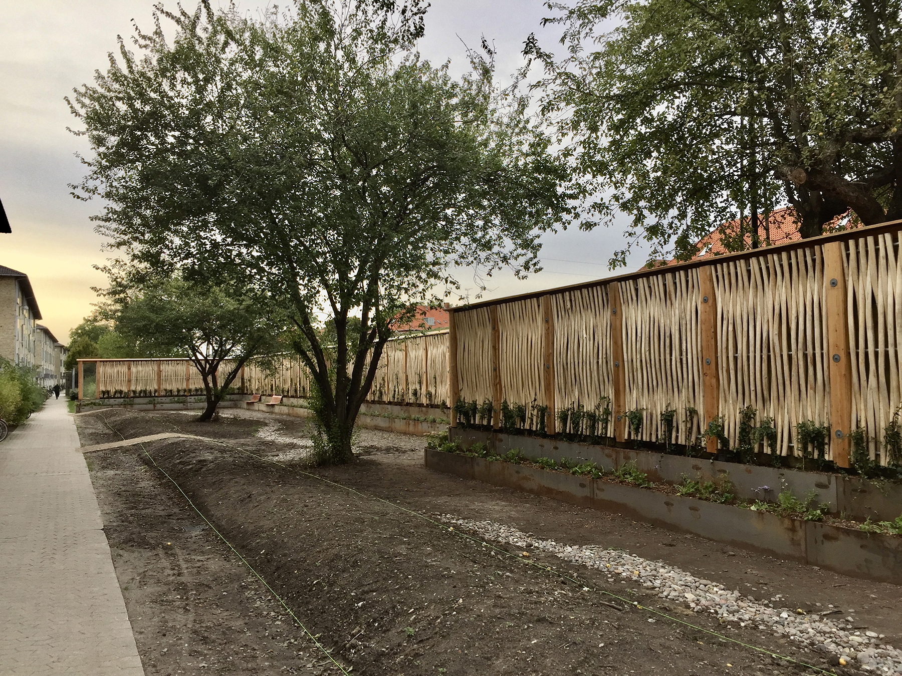 a barrier covered with vegetation