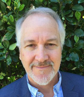 man smiles for the camera