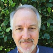 man smiles for the camera