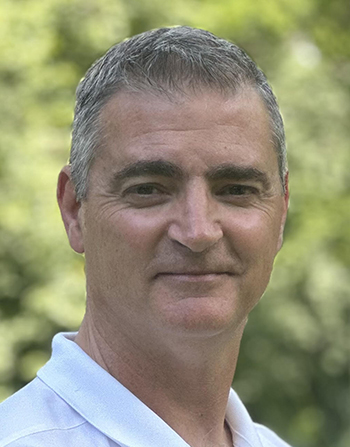 a man smiles for the camera