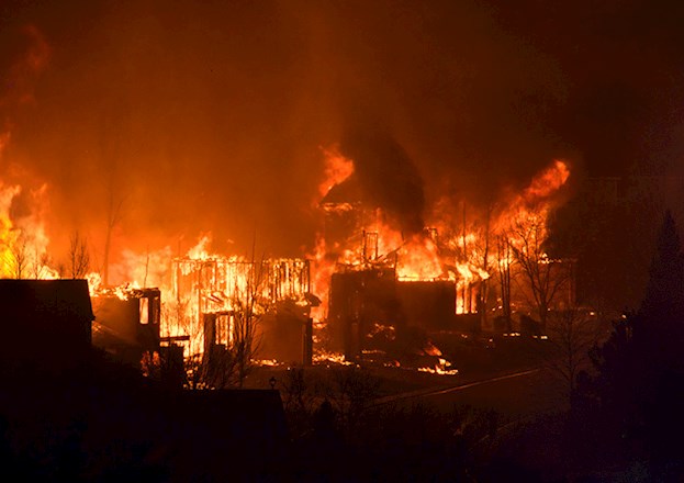 A night-time wildfire is burning up homes.