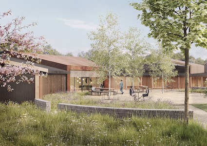 Full color rendering shows a patio with picnic tables, green trees, grass, and bushes, and a wooden structure with glass window.