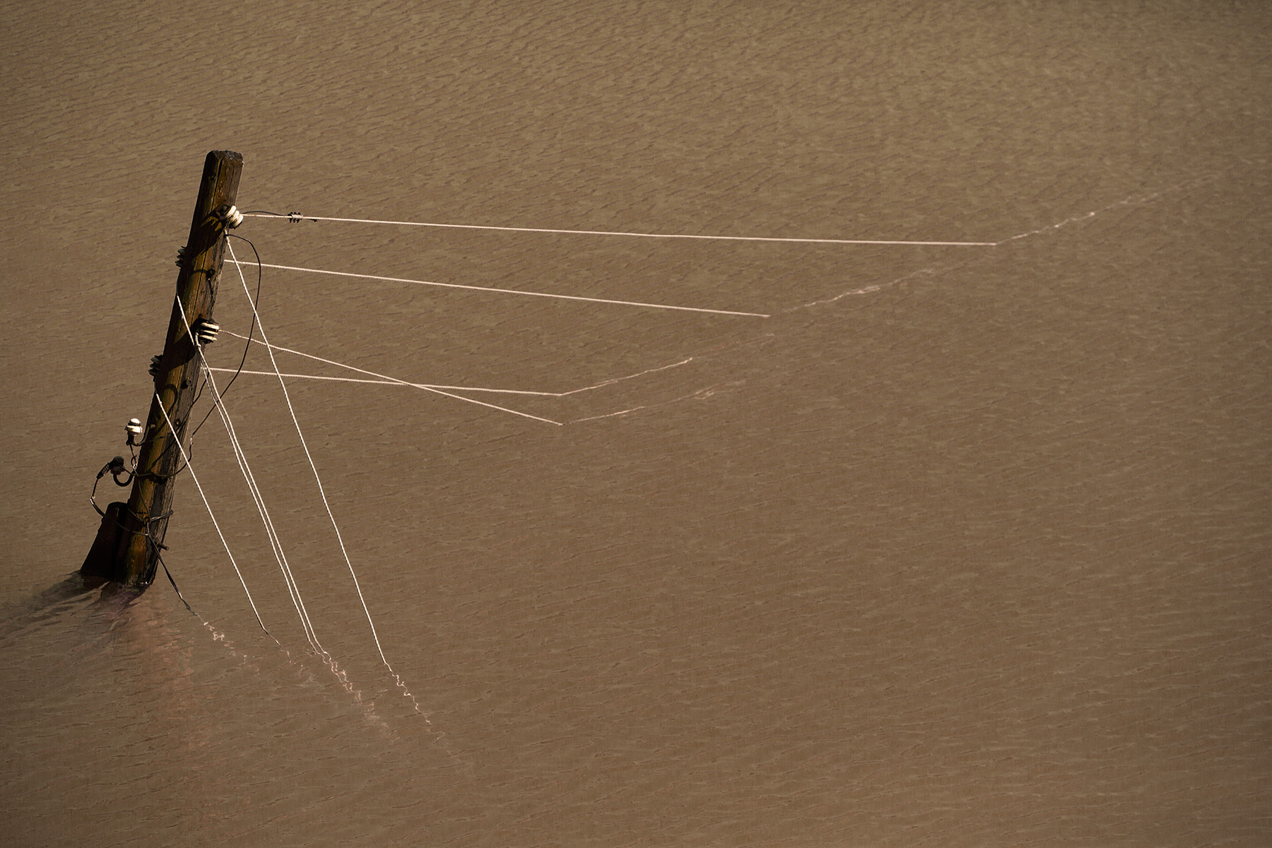 Seasonal washouts of a riverine transmission line necessitated new design