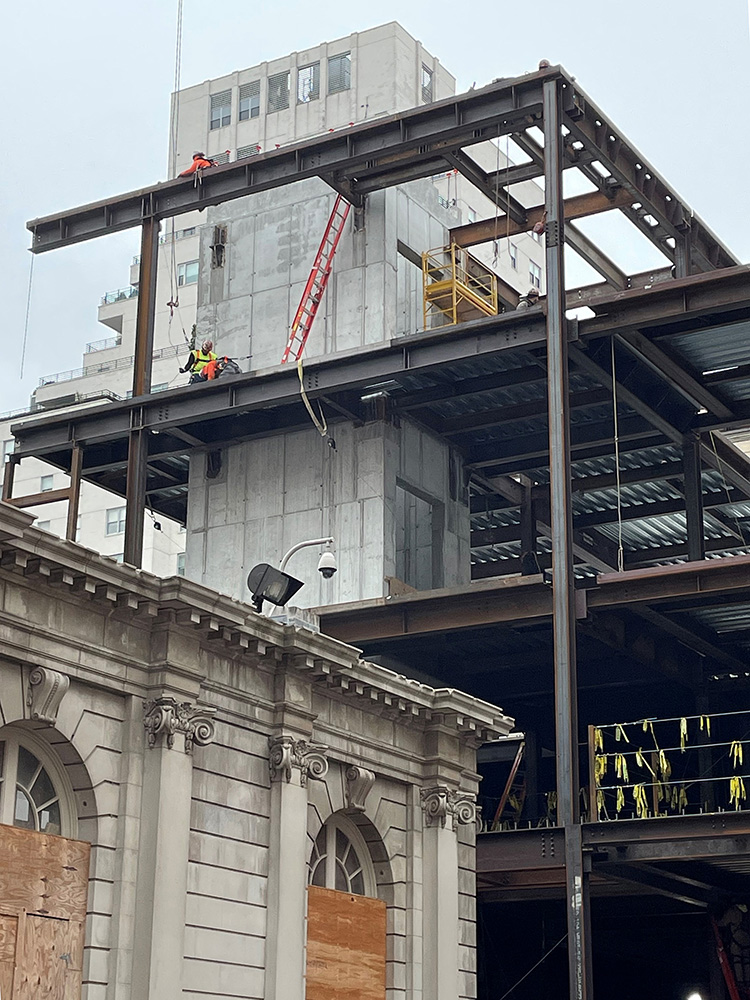 Photo shows an elevator core shear wall being constructed. 