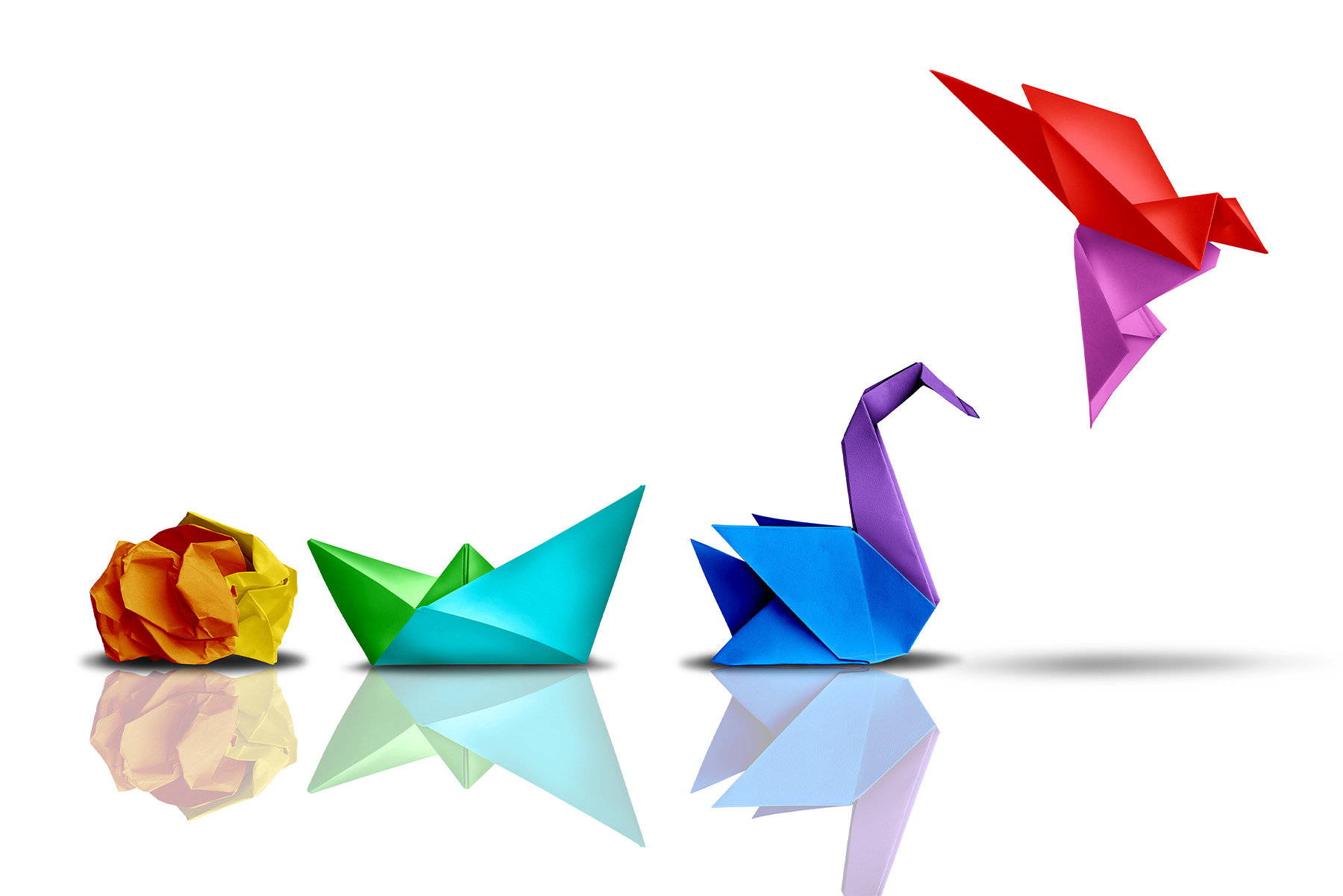 There are four images on the picture. The first shows a crumpled piece of pager. The second the crumpled paper transformed into another shape. The third shows a swan, and the fourth shows the bird taking flight. These images represent evolution, transformation, innovation, and creativity