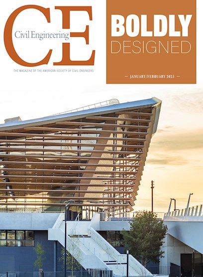 A white concrete staircase leads from the sidewalk to the entrance of the building. A white pedestrian bridge is to the right.