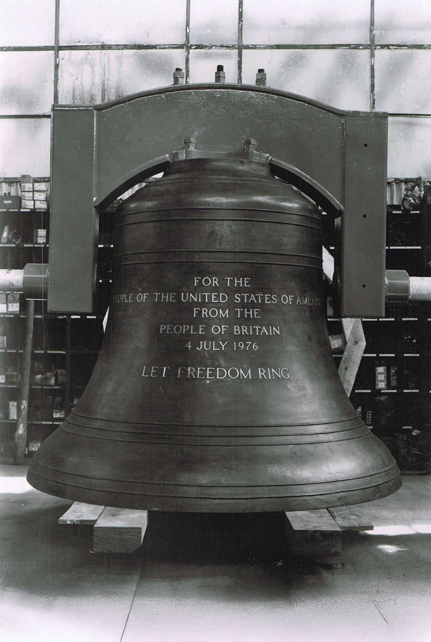 A black and white image of a bronze bell with the engraving: “For the people of the United States of America from the people of Britain. 4 July 1976. Let freedom ring.” 
