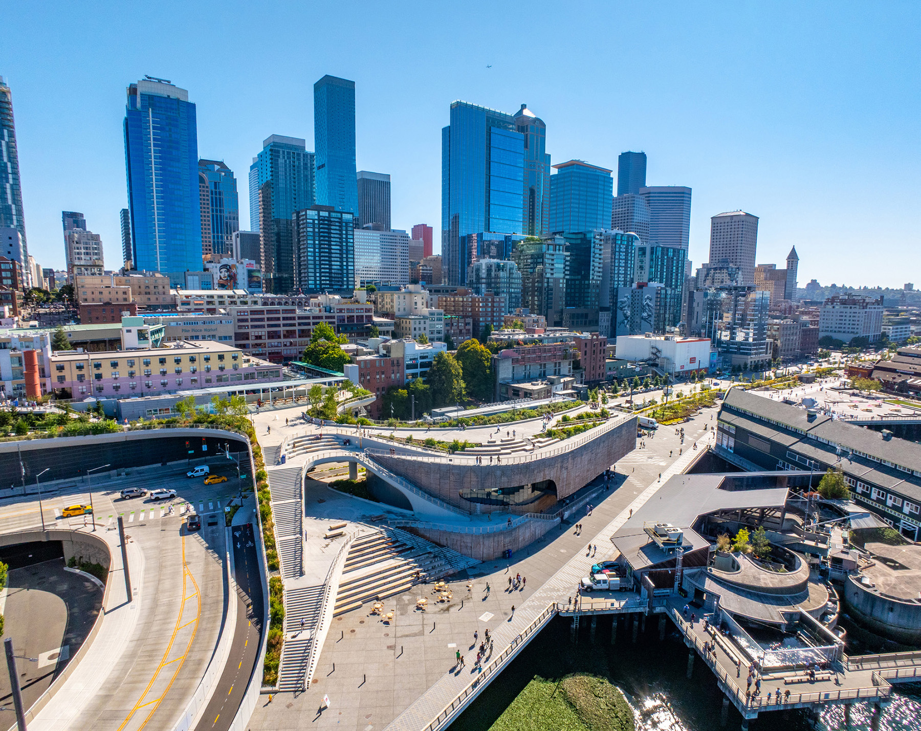An aerial photo shows the curving concrete structure that forms the Overlook Walk. 