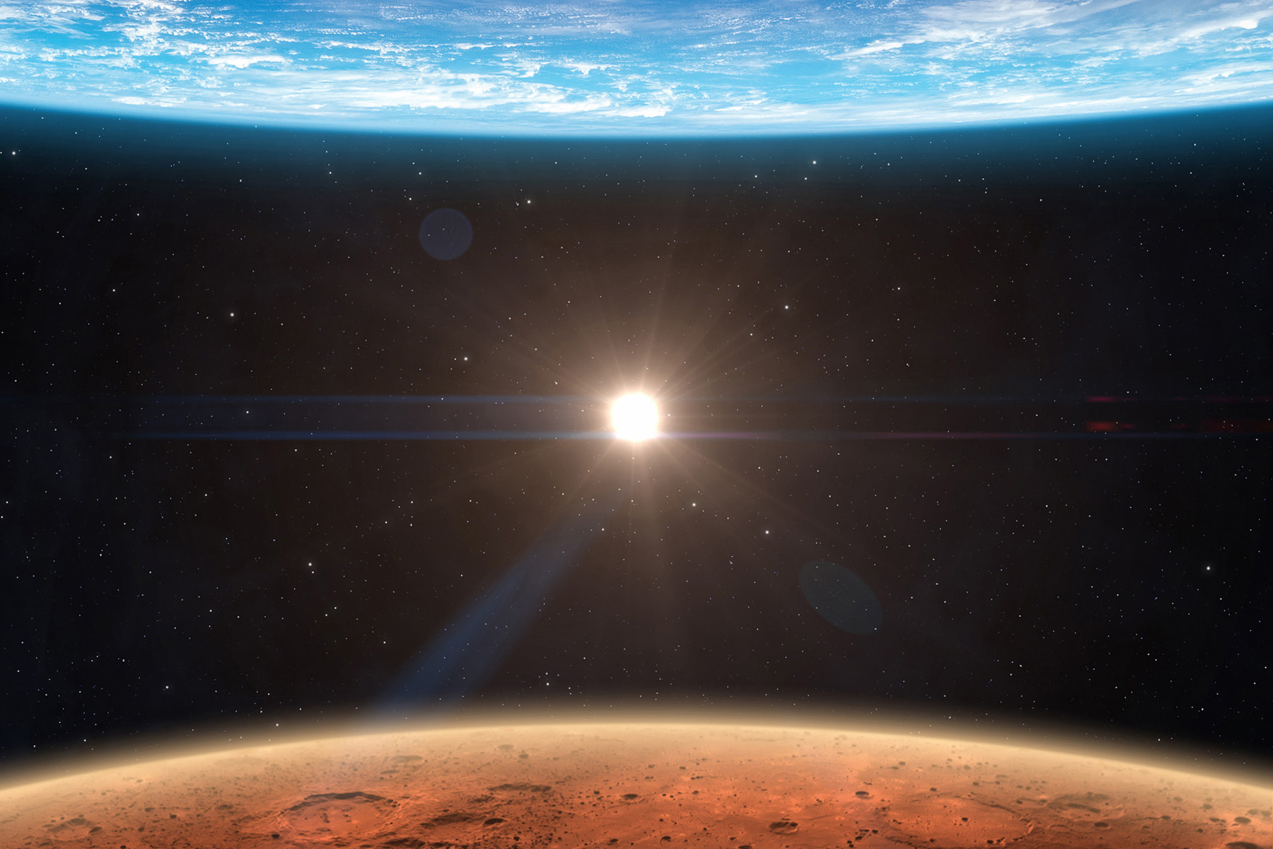 The full-page photograph depicts Earth at the top, Mars at the bottom, and the sun in-between. 