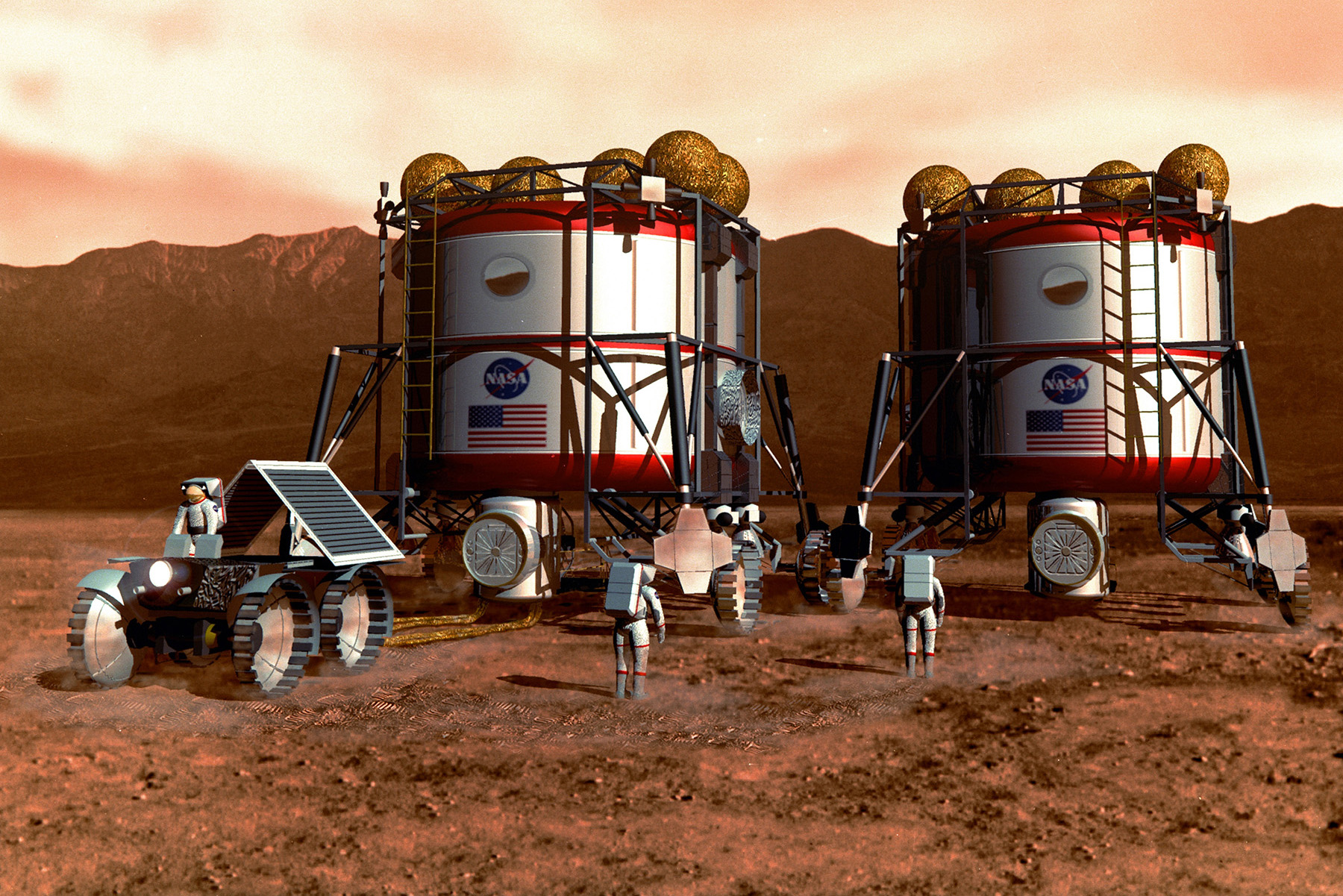 The image shows two upright cylindrical habitats on Mars, bearing the NASA logo and American flag, surrounded by astronauts and a rover. 