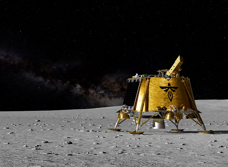 A rendering of a four-legged square-ish gold, shimmering piece of equipment stands upright on the surface of the moon. 