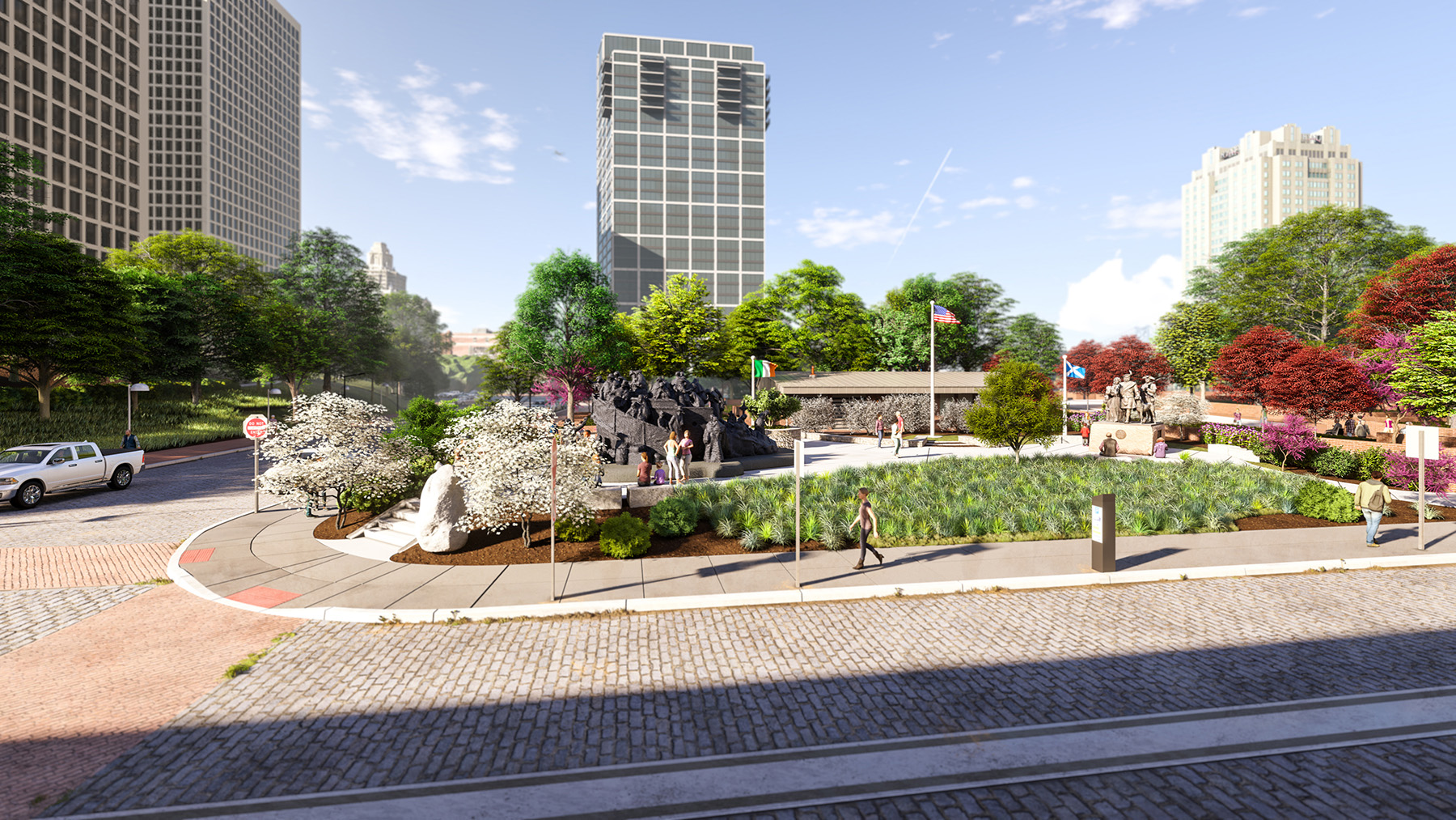 The rendering shows a pedestrian walking along a sidewalk near a cobblestone road and small urban park, surrounded by tall buildings. 