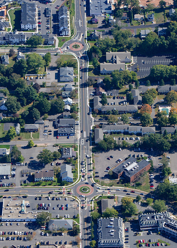 An aerial photograph shows the locations of the two roundabouts in Glastonbury, Connecticut, connected by a short stretch of straight road. 