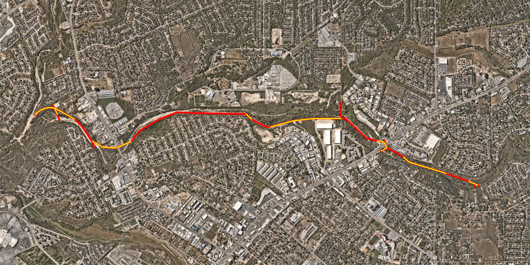 Map shows the project alignment. The red line indicates open-cut construction, and the yellow line indicates the tunneled segments. 