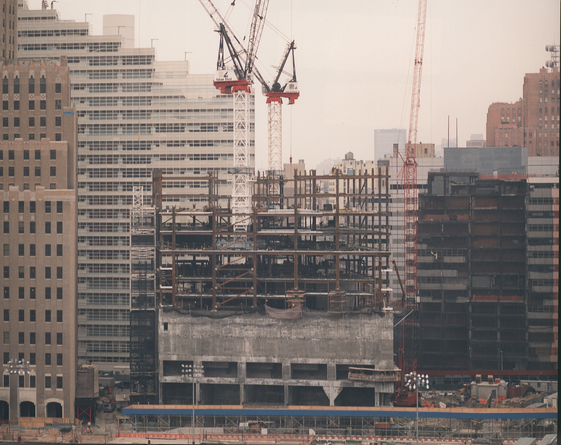 Photograph shows the construction of a tall building.