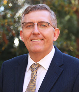 headshot of Webster