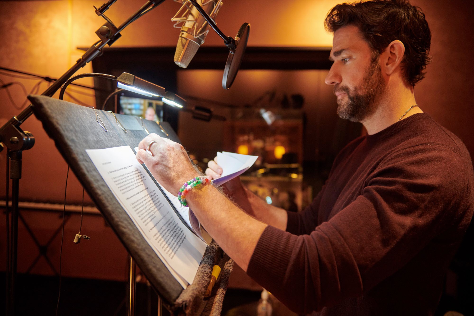 photo of John Krasinski recording narration