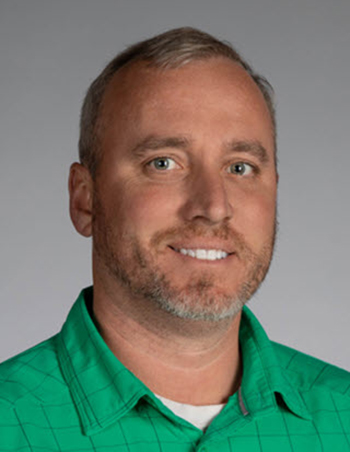 man smiles for the camera