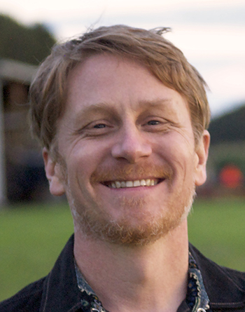 man smiles for the camera