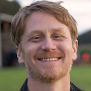 man smiles for the camera