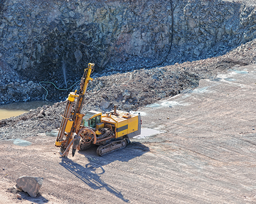Driller in a quarry mine
