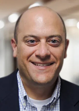 man smiles for the camera