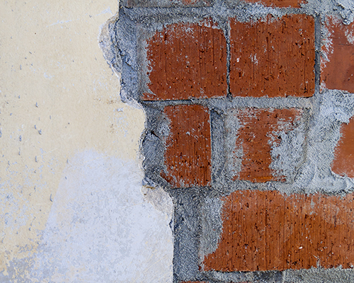 Close up of wall with exposed brick and mortar