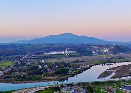 Aerial view of Aconcagua river surrounded by vegetation and Mauco Hill in background, Valparaiso, Chile