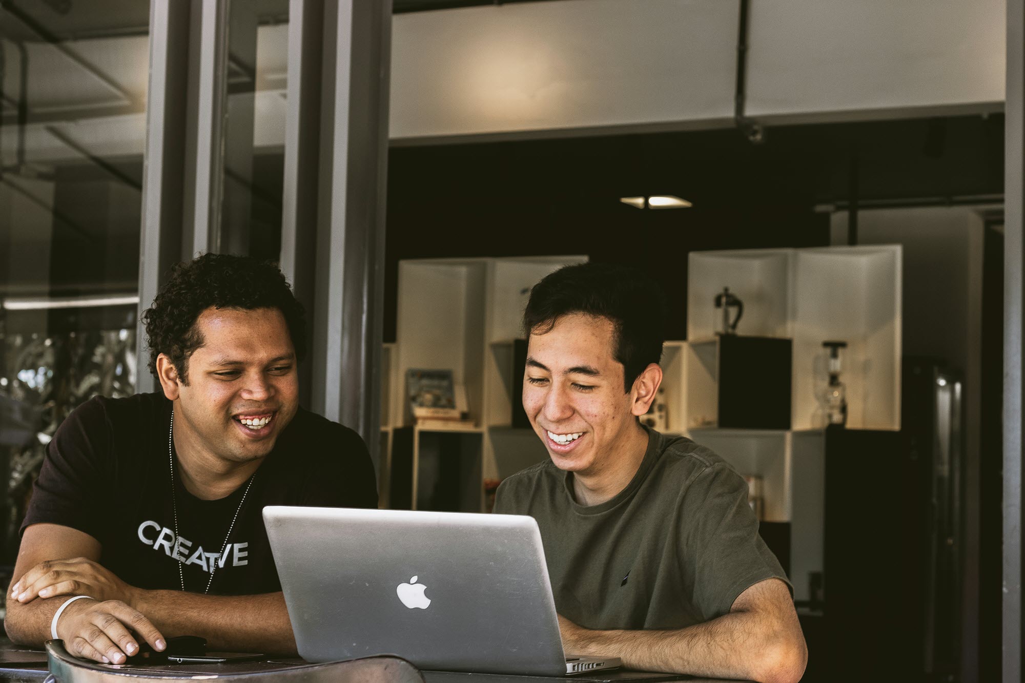 Photo of two people working together