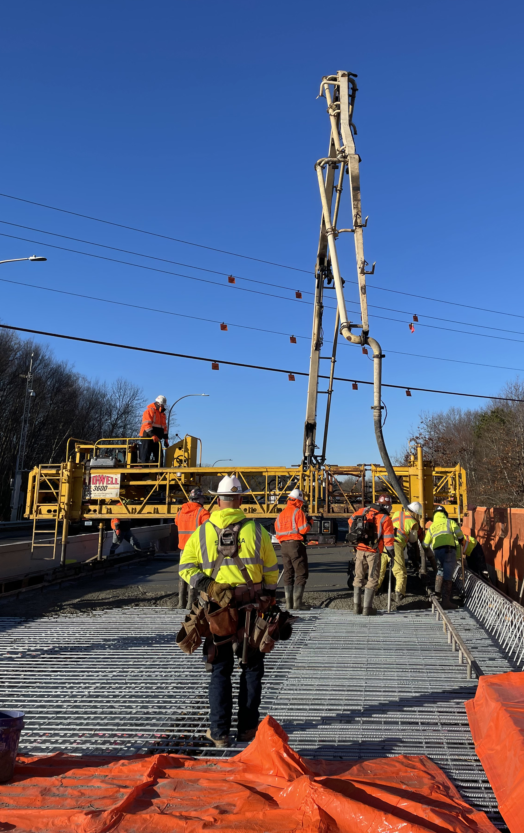 a crew with heavy equipment works on a highway project a crew with heavy equipment works on a highway project