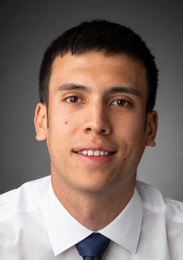 man smiles for the camera