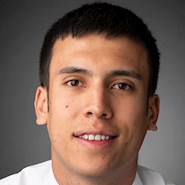 man smiles for the camera