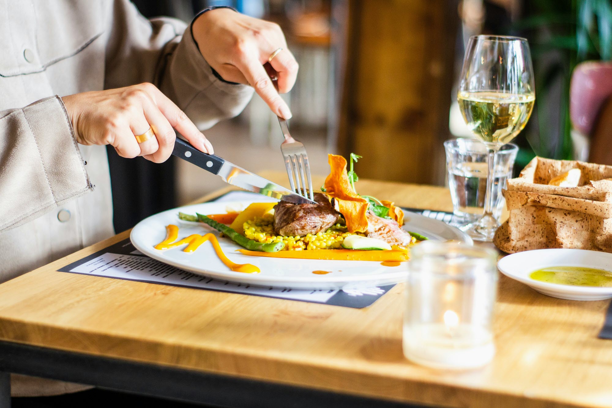 Photo of someone cutting steak