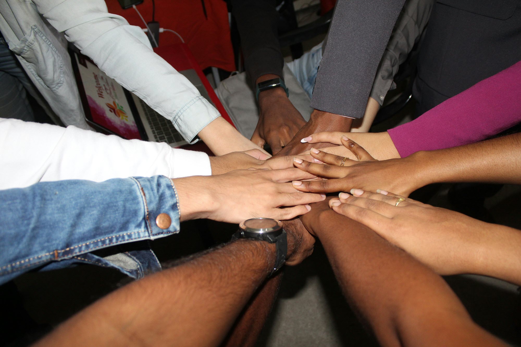 Photo of a circle of hands