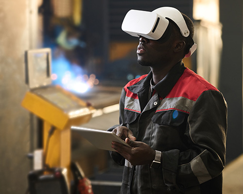 Young African American male with headset and tablet