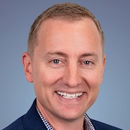 man smiles for camera