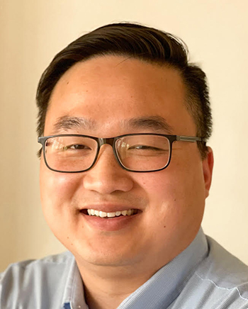 man smiles for camera