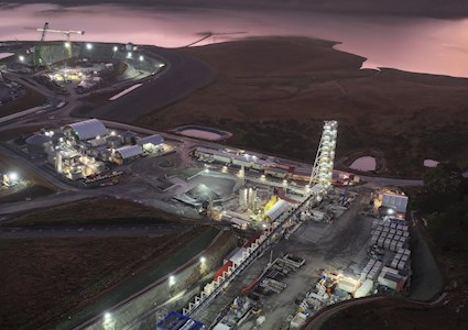 aerial view of a pumped storage power station with river and mountain in background