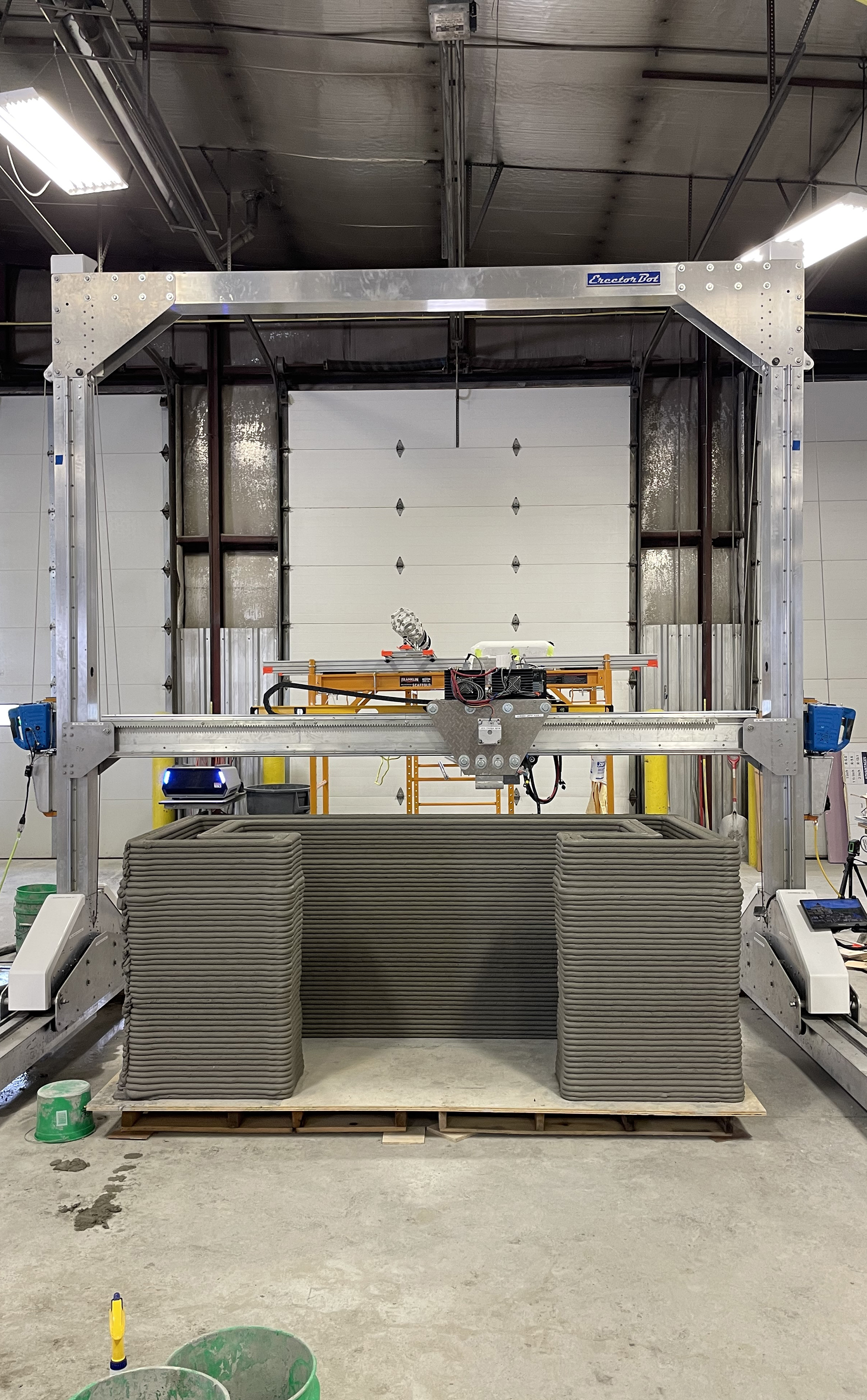 an apparatus made mostly of metal in ia factory-like setting