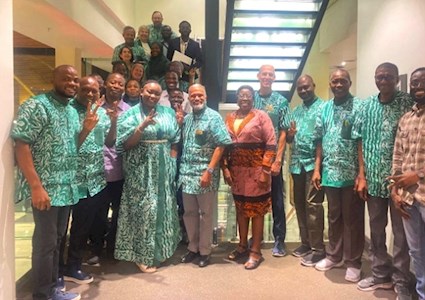 In Lagos, Nigeria, ASCE 2025 President Feniosky Peña-Mora, front center, and Executive Director Tom Smith meet enthusiastic members of the Nigeria Section, led by President Austin Odibi. Most wear traditional Nigerian tunics provided by Region 10 Governor Rasheed Hassan.