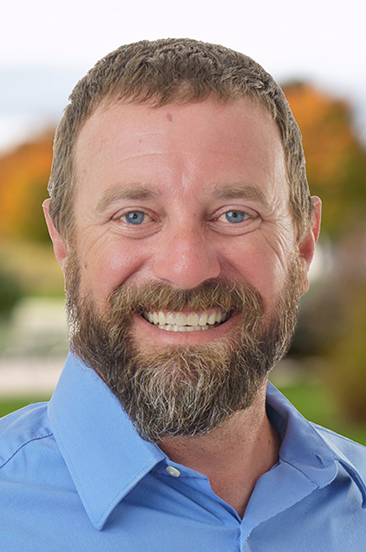 man smiles for the camera