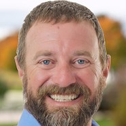 man smiles for the camera