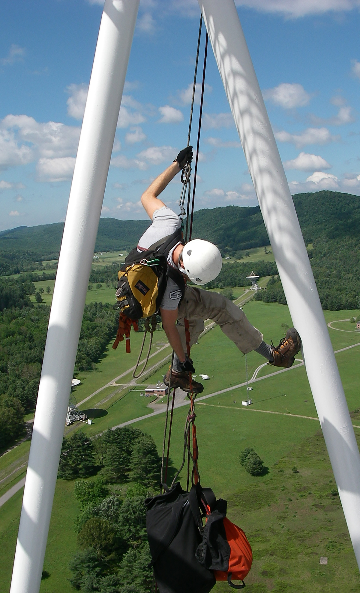 a person rappels off the giant telescope a person rappels off the giant telescope