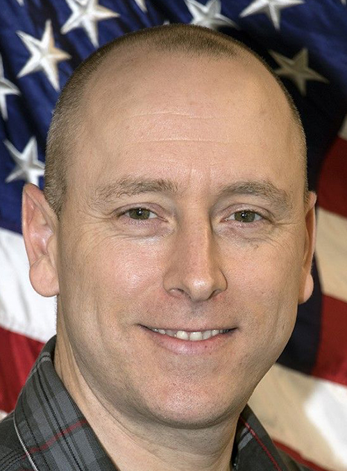 man smiles for camera