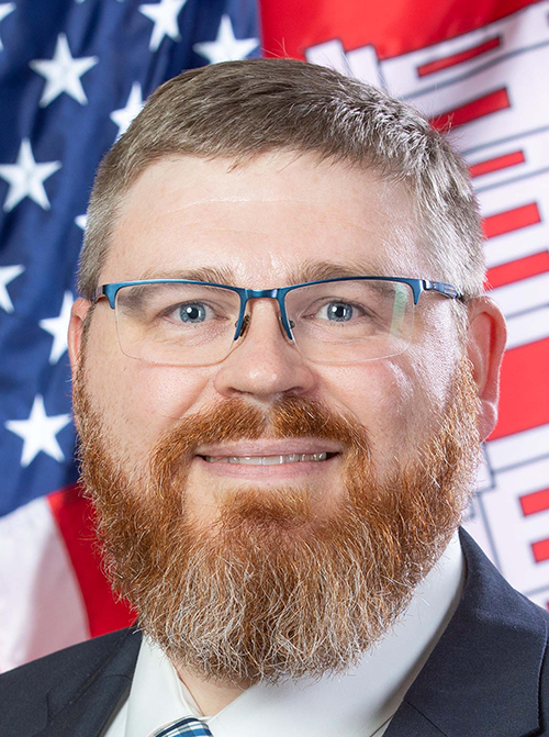 man smiles for camera