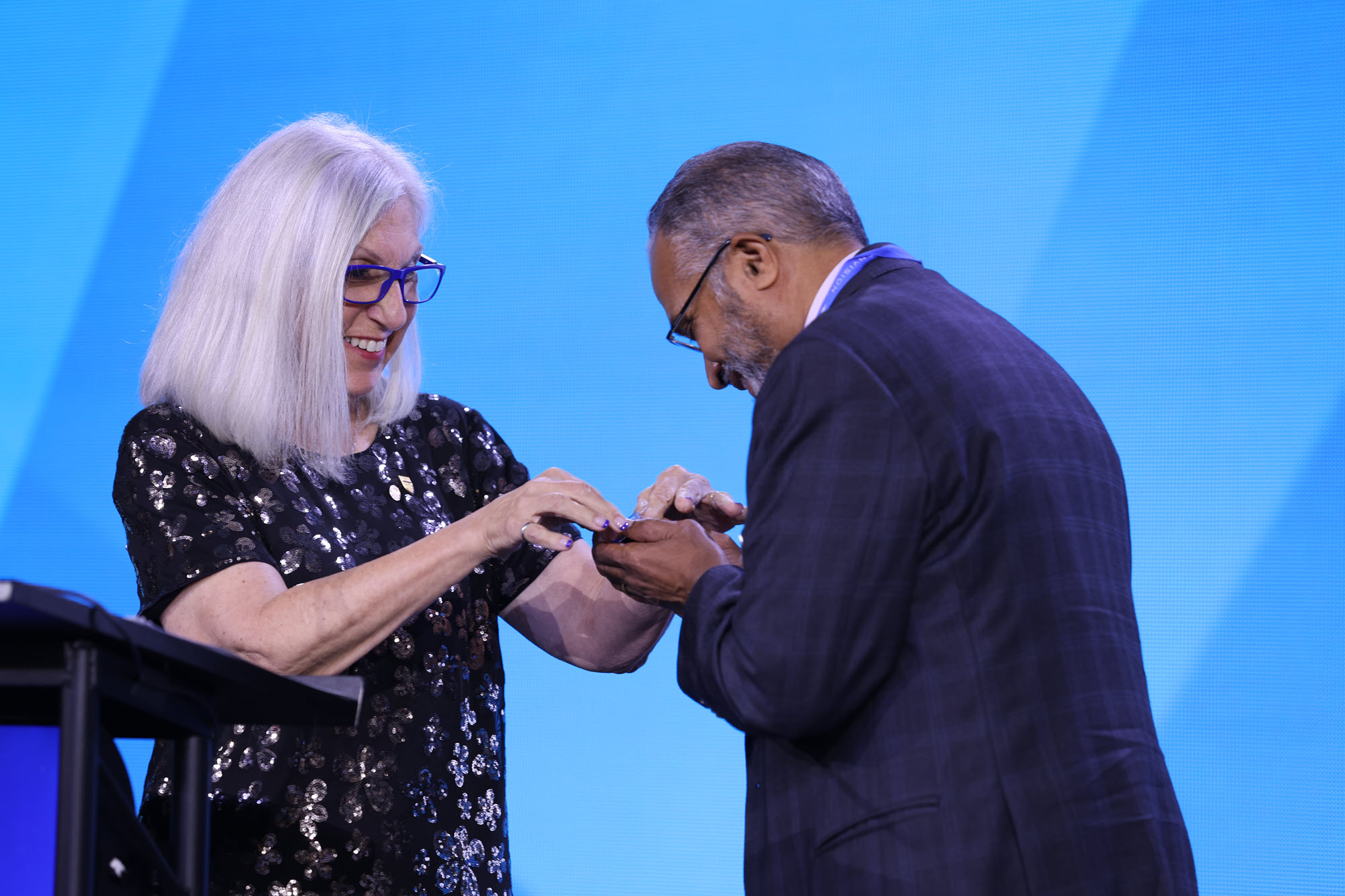 photo of presidential pin handoff