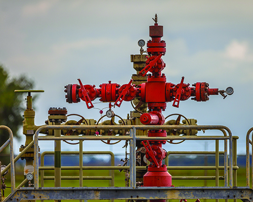 Red well head at gas field station