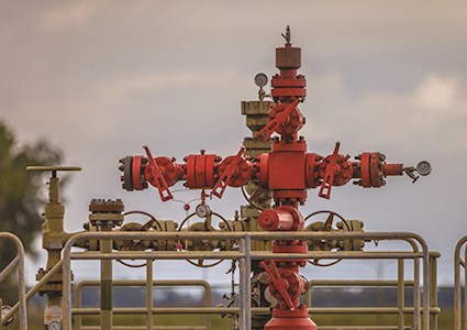 Red well head at gas field station